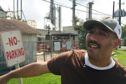 In this Sept. 2, 2017 photo, community environmental activist Juan Flores talks to a reporter in Galena Park, Texas. Petrochemical corridor residents say air that is bad enough on normal days got unbearable as Harvey crashed into the nation's fourth-largest city and then yielded the highest ozone pollution of the year anywhere in Texas.
