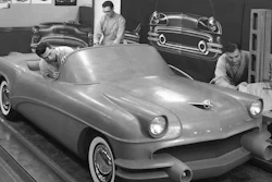 This 1954 photo Courtesy of General Motors shows Buick Design Studio creative clay sculptors as they mold the clay on a model GM automobile.