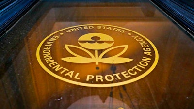 In this Sept. 21, 2017, photo, a sign on a door of the Environmental Protection Agency in Washington. The EPA says it has recovered 517 containers of “unidentified, potentially hazardous material” from highly contaminated toxic waste sites in Texas that flooded last month during Hurricane Harvey. But the agency has not provided details about which Superfund sites the material came from, why the contaminants at issue have not been identified and whether there’s a threat to human health.