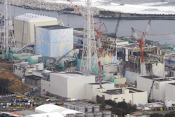 In this March 11, 2012, file photo, three melted reactors, from left, Unit 1, Unit 2 and Unit 3, are seen at Fukushima Dai-ichi nuclear power plant in Okuma, Fukushima prefecture, Japan. Japan's government approved on Tuesday, Sept. 26, 2017 a revision to the decommissioning plan for the Fukushima nuclear plant, delaying by two more years the removal of radioactive fuel rods in two of the three reactors damaged in the 2011 disaster. It still plans for melted fuel to be removed starting in 2021, but the lack of details about the duration raises doubts if the cleanup can be completed within 40 years.