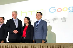 Rick Osterloh, senior vice president of hardware for Google, second from left, and Cher Wang, chairperson of HTC, shake hands during a press conference in New Taipei City, Taiwan, Thursday, Sept. 21, 2017. Google is biting off a big piece of device manufacturer HTC for $1.1 billion to expand its efforts to build phones, speakers and other gadgets equipped with its arsenal of digital services. At left is Mario Queiroz, vice president of product management at Google, and at right is Chia-Lin Chang, president of smartphones and connected devices for HTC.