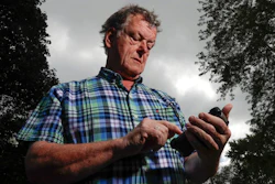 Towne & Country Building Inspection owner Scot McLean looks at his calendar outside his Fox Point, Wis., home Wednesday, Sept. 27, 2017. Towne & Country downloaded several apps to enhance the Google calendar the company uses for customer appointments. In July, McLean noticed some glitches with his Google calendar. McLean's staffer in charge of technology determined that the apps were vulnerable to hacking, and someone was able to log in and erase the appointments.