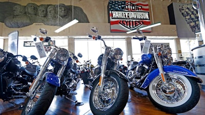 This Tuesday, April 25, 2017, photo shows Harley-Davidson motorcycles on display in the showroom at a dealership in Miami. On Wednesday, Sept. 27, 2017, the Commerce Department releases its August report on durable goods.