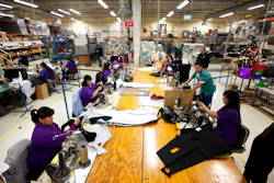 In this Friday, Dec.27, 2013 file photo, workers manufacture car dash mats at a maquiladora belonging to the TECMA group in Ciudad Juarez, Mexico. In Mexico where the auto industry has boomed under the North American Free Trade Agreement, the industry has created a class of workers who are barely getting by. Many can’t afford even a used car, taking home as little as $50 per week after deductions for mortgages and cafeteria meals.