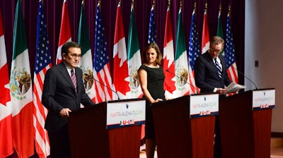 From left, Mexico's Secretary of Economy Ildefonso Guajardo Villarreal, Canada's Foreign Affairs Minister Chrystia Freeland and U.S. Trade Representative Robert Lighthizer attend a news conference on the NAFTA negotiations in Ottawa on Wednesday, Sept. 27, 2017.