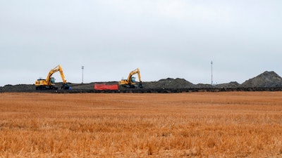 In this Oct. 11, 2013 file photo, cleanup continues on at the site of an oil pipeline leak and spill north of Tioga, N.D. Four years later, cleanup completion is in sight for the 20,000-barrel oil spill in a North Dakota farmer's field. Excavation of the affected site is scheduled for completion by the end of the month, with a test crop to be planted on the land next spring. The spill from a Tesoro pipeline was discovered by a Tioga farmer in September 2013. It has been called one of the largest onshore spills in U.S. history.