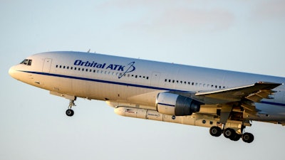 In this Thursday, Dec. 15, 2016, file photo, the Orbital ATK L-1011 aircraft lifts off from Cape Canaveral Air Force Station, Fla. Northrop Grumman is buying aerospace and defense technology company Orbital ATK for about $7.8 billion as activity in the sector heats up along with global tensions, announced Monday, Sept. 18, 2017.