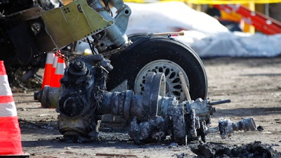 In this Feb. 16, 2009, file photo, debris at the scene of a plane crash site of Continental Connection Flight 3407 in Clarence Center, N.Y. An influential industry panel plans to vote Sept. 14, 2017, on recommendations that the Federal Aviation Administration eliminate or scale back dozens of safety rules, including one on airline pilot qualifications. The recommendations are contained in a report to the FAA’s Aviation Rulemaking Advisory Committee in response to President Donald Trump's directives to cut government regulations.