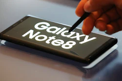 A man demonstrates Samsung Electronics' Galaxy Note 8 during a media day in Seoul, South Korea, Tuesday, Sept. 12, 2017. Samsung Electronics says its aims to launch a foldable smartphone next year under its Galaxy Note brand. Koh Dong-jin, president of mobile business at Samsung Electronics, said Tuesday that the company is currently setting its eyes on 2018 to release a smartphone with a bendable display but there are several hurdles it has to overcome.