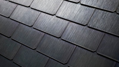 This file photo provided by Tesla shows a detail of Tesla's new textured solar roof tiles. On Thursday, Aug. 31, 2017, Tesla Inc. started production of the cells for its solar roof tiles at its factory in Buffalo, N.Y. The company has already begun installing its solar roofs, which look like regular roofs but are made of glass tiles. Until the Buffalo factory opened, it had been making them on a small scale near its vehicle factory in Fremont, Calif.