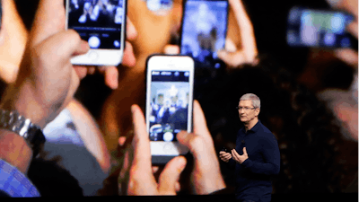 In this Wednesday, Sept. 7, 2016, file photo, Apple CEO Tim Cook announces the new iPhone 7 during an event to announce new products, in San Francisco.