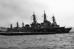 An Arleigh Burke-class destroyer anchored at the United States Fleet Activities Yokosuka Navy base.