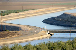 In this Oct. 2, 2009 file photo, in California's Westland Water District of the Central Valley, canals carry water to southern California. A new federal audit says the federal government improperly spent tens of millions of dollars on the California water project. An audit by the inspector general's office of the U.S. Interior Department says federal officials contributed the taxpayer money to Gov. Jerry Brown's plans to build two giant water tunnels.