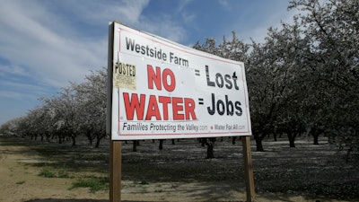 In this Feb. 25, 2016, file photo, a sign calling attention to the loss of jobs blamed on the lack of water is displayed near Lemoore, Calif. With no groups stepping forward to bankroll Gov. Jerry Brown's ambitious plan to re-engineer California's north-south water delivery system, state and local officials now say millions of California water customers will have to spend billions funding the state's biggest water project in decades.