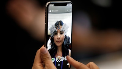 The new iPhone X is displayed in the showroom after the new product announcement at the Steve Jobs Theater on the new Apple campus.