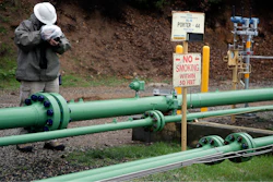 In this Jan. 12, 2017 file photo, an employee uses an infrared camera to detect a gas leak at the Southern California Gas Company's Aliso Canyon storage facility near the Porter Ranch neighborhood of Los Angeles. A third of the wells that inject natural gas into underground storage were taken out of service weeks after a troubled Los Angeles facility restarted following a massive blowout. Southern California Gas Co. said Monday, Sept. 11, that it notified state regulators in August that 13 of the 39 wells at Aliso Canyon were shut down after detecting a pressure buildup.