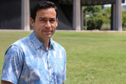 In this Aug. 17, 2017, photo, Hawaii state Rep. Chris Lee poses in front of the capitol. Hawaii is considering doling out universal basic income, where everyone gets a chunk of money with no strings attached, and Lee is a supporter. The idea has attracted supporters across the U.S. and elsewhere as technology leaders, elected officials and economists debate what our lives will look like when robots and machines take over more and more jobs that human beings have held for decades.