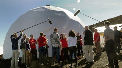 This photo released by the University of Hawaii shows Hawaii Space Exploration Analog and Simulation, HI-SEAS crew members emerging from their habitat on Sunday, Sept. 17, 2017, after eight months of living in isolation in a Mars-like habitat in Mauna Loa volcano, Big Island, Hawaii. The six NASA-backed research subjects were studied by researchers to understand better the psychological impacts of a long-term manned mission to space would have on astronauts. NASA hopes to send humans to Mars by the 2030s.