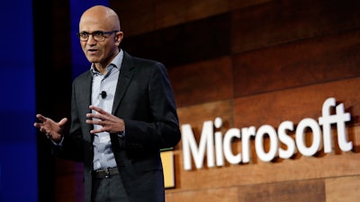 In this Wednesday, Nov. 30, 2016, file photo, Microsoft CEO Satya Nadella speaks at the annual Microsoft shareholders meeting, in Bellevue, Wash. Nadella has written an autobiography recounting his efforts to transform the technology company with a focus on empathy and changing its workplace culture. The book, “Hit Refresh,” also reveals some personal challenges, such as his risky move to switch his green card to a temporary work visa in the 1990s so that his wife could join him in the United States.