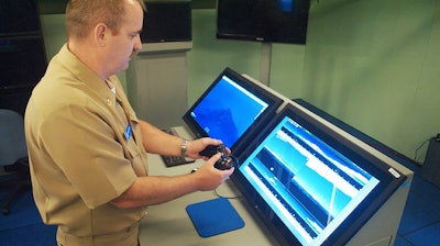 A sailor tests using an Xbox controller at a lab in northern Virginia.