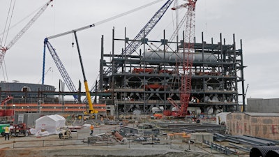 In this Sept. 21, 2016, file photo, V.C. Summer Nuclear Station's unit two's turbine is under construction near Jenkinsville, S.C., during a media tour of the facility. Solicitor General Bob Cook, one of South Carolina’s top prosecutors, said a state law used by utilities to raise customers’ rates to fund the now-defunct nuclear project is “constitutionally suspect.”