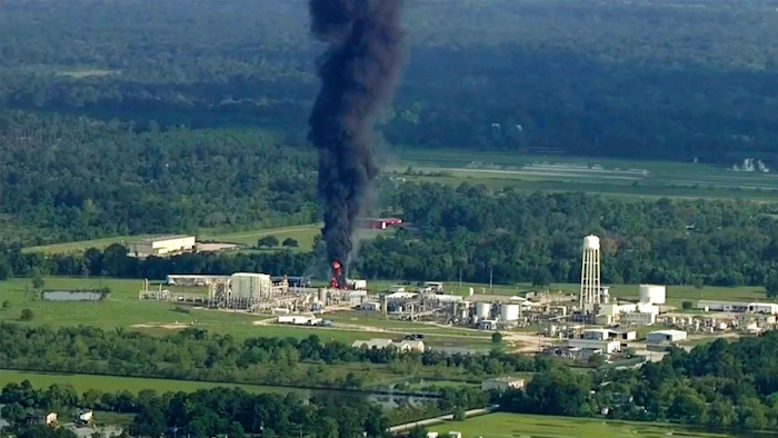 In this Sept. 1, 2017, file photo, smoke rises from a chemical plant in Crosby, near Houston, Texas. Nearly 20 Houston-area residents say test results have detected toxic substances in soil, water and ash samples taken miles from the chemical plant that flooded during Hurricane Harvey, caught fire and partially exploded. The findings were disclosed Monday afternoon, Oct. 2, 2017, in a letter the residents' lawyers mailed to the chief executive of the plant's owner, Arkema Inc., and several regulatory agencies, giving notice that they planned to sue.