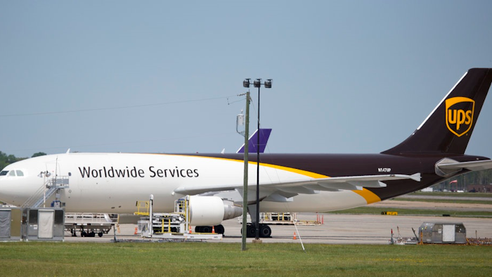 In this Tuesday, April 18, 2017 photo, a United Parcel Service cargo plane sits idle during the day as it awaits loading at Richmond International Airport in Sandston, Va.. UPS says in court records that it suspects one of its pilots obtained secret business plans for the shipping giant's aircraft fleet and posted them online. In a federal lawsuit filed the week of Oct. 6, 2017, UPS says its strategic plans are highly confidential, and says a PowerPoint presentation was intended only for senior executives.