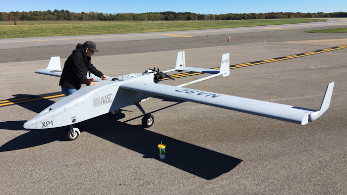 In this Oct. 17, 2017 photo, Mike Busutil of Navmar Applied Sciences Corporation prepares to do flight tests with a Tigershark drone at Griffiss International Airport in Rome, N.Y. New York state is investing $30 million to create a 50-mile drone-testing corridor between Rome and Syracuse.