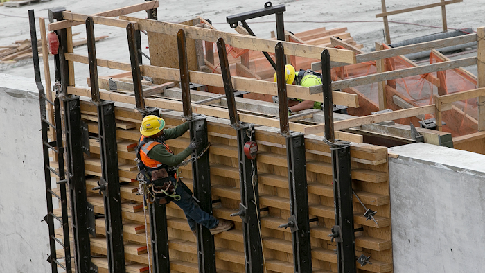 Crews work on one of the sidewalls of the damaged main spillway of the Oroville Dam on Thursday, Oct. 19, 2017, in Oroville, Calif. California officials say repair costs at the nation's tallest dam will be nearly double the original estimate of $275 million. The main spillway and emergency spillway suffered significant damage during storms last February, prompting fears of massive flooding.