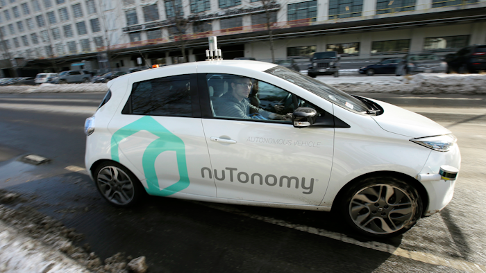 In this Tuesday, Jan. 10, 2017, file photo, an autonomous vehicle is driven by an engineer on a street in an industrial park in Boston. A new study inspired by Boston’s early experiments with self-driving cars finds that the technology could ease congestion, but also lead to more cars on the road and further encourage urban sprawl.