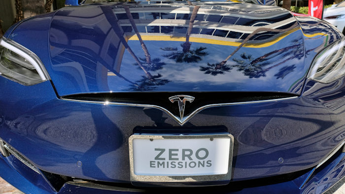 This Oct. 24, 2016, file photo shows Tesla Model S on display in downtown Los Angeles. Tesla Motors fired hundreds of workers after completing its annual performance reviews, even though the electric automaker is trying to ramp up production to meet the demand for its new Model 3 sedan. The Palo Alto, California-based company confirmed the cuts in a Saturday, Oct. 14, 2017 statement, but didn't disclose how many of its 33,000 workers were jettisoned.