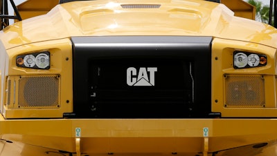 This file photo shows the front of a Caterpillar 725C end dump truck at a dealer in Miami.