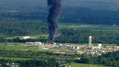 In this Sept. 1, 2017, file photo, smoke rises from a chemical plant in Crosby, near Houston, Texas. Nearly 20 Houston-area residents say test results have detected toxic substances in soil, water and ash samples taken miles from the chemical plant that flooded during Hurricane Harvey, caught fire and partially exploded. The findings were disclosed Monday afternoon, Oct. 2, 2017, in a letter the residents' lawyers mailed to the chief executive of the plant's owner, Arkema Inc., and several regulatory agencies, giving notice that they planned to sue.