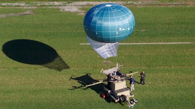 In this undated aerial photo provided by Drone Aviation Corp. shows a tethered balloon, called Winch Aerostat Small Platform, or WASP. The U.S. Border Patrol is considering another type of surveillance balloon to spot illegal activity. It’s part of an effort to see if more eyes in the sky translate to fewer illegal border crossings.