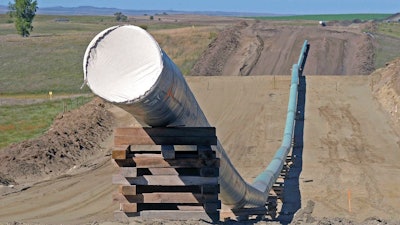 This Sept. 29, 2016, file photo, shows a section of the Dakota Access pipeline under construction near St. Anthony in Morton County, N.D. A federal judge ruled Wednesday, Oct. 11, 2017, that the Dakota Access oil pipeline can continue operating while a study is completed to assess its environmental impact on the Standing Rock Sioux.