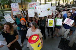 Member of the Texas Campaign for the Environment prepare to deliver over 2,300 letters from Texas families to the Environmental Protection Agency's Region VI office in Dallas, Thursday, Oct. 12, 2017. The letters are calling for saving federal cleanup programs under the Trump Administration. The EPA has approved a plan to remove sediments laced with highly toxic dioxin from a partially submerged Superfund site near Houston damaged during Hurricane Harvey.