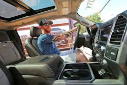 In this Monday, Oct. 9, 2017, photo, a man looks at the interior of a fully-loaded F-450 Super Duty Limited, the biggest version of the Ford F-Series, on display at the State Fair of Texas in Dallas. America's favorite luxury vehicle is a pickup truck. Buyers are increasingly outfitting their pickups with all the comforts of luxury cars, from heated and cooled seats to backup cameras to panoramic glass roofs.