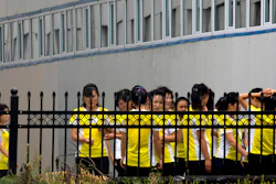 North Korean workers gather after lunch at the Hong Chao Zhi Yi garment factory in Hunchun in northeastern China. At a time when North Korea faces sanctions on many exports, it sends of tens of thousands of workers worldwide bringing in revenue estimated at anywhere from $200 million to $500 million. That could account for a sizable portion of North Korea’s nuclear weapons and missile programs.
