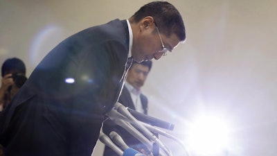 Nissan Chief Executive Hiroto Saikawa bows at the end of a press conference in Yokohama. Nissan is recalling 1.2 million vehicles in Japan that were produced between October 2014 and September this year.