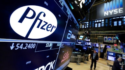 This April 6, 2016, file photo shows the Pfizer logo appearing on a screen above its trading post on the floor of the New York Stock Exchange. Pfizer said Tuesday, Oct. 10, 2017, it may sell its consumer health care business, which includes the Advil brand, as part of a strategic review.