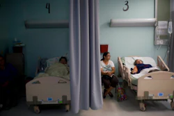 In this Thursday, Sept. 28, 2017, file photo, patients lie in their beds at a hospital in Catano, Puerto Rico. The U.S. Food and Drug Administration says drug shortages are possible because of expected long-term power outages in Puerto Rico. FDA Commissioner Dr. Scott Gottlieb said in a statement Friday, Oct. 6, 2017, that the agency is working to prevent shortages of about 40 medicines. He didn't name the medicines involved.