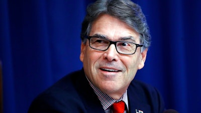 In this July 18, 2017, file photo, Energy Secretary Rick Perry attends a news conference at the National Press Club in Washington. The Energy Department says Perry has taken at least six trips on government or private planes costing an estimated $56,000.