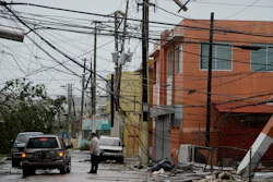 In this Wednesday, Sept. 20, 2017 file photo, power lines are down after the impact of Hurricane Maria, which hit the eastern region of the island in Humacao, Puerto Rico. In the wake of Hurricane Maria, Facebook pledged to send a 'connectivity team' to help restore communications in ravaged Puerto Rico. It's just one of several tech companies - among them Tesla, Google, Cisco, Microsoft and a range of startups - with their own disaster response proposals, most aimed at getting phone and internet service up and running.