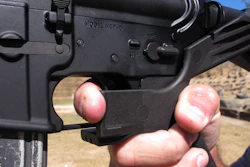 In this Oct. 4, 2017, file photo, shooting instructor Frankie McRae demonstrates the grip on an AR-15 rifle fitted with a 'bump stock' at his 37 PSR Gun Club in Bunnlevel, N.C. The Brady Center to Prevent Gun Violence filed the lawsuit on Friday, Oct. 6, 2017, against the makers and sellers of “bump stocks,” which use the recoil of a semiautomatic rifle to let the finger 'bump' the trigger, allowing the weapon to fire continuously. The devices were used by Stephen Paddock when he opened fire on a country music festival in Las Vegas, killing dozens of people.