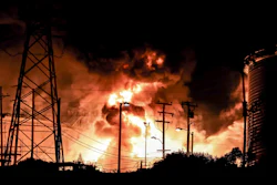 In this Tuesday, Oct. 17, 2017, photo provided by Jack Zellweger, a fire rages at the Chevron El Segundo Refinery in El Segundo, Calif. A fire that erupted at the West Coast's largest oil refinery threatened storage tanks and sent huge flames into the sky and black smoke across neighborhoods before crews quickly smothered it. Dozens of firefighters responded late Tuesday to the 1,000-acre refinery just south of Los Angeles, which processes nearly 275,000 gallons of crude per day.