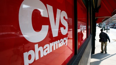 This March 25, 2014, file photo shows a CVS store and pharmacy in Philadelphia. According to a Thursday, Oct. 26, 2017 report in The Wall Street Journal., the drugstore chain is in talks to buy Aetna, the nation’s third-largest insurer. Analysts say such a deal would create a health colossus that can reach deeper into the average customer’s life to manage care and cut costs.