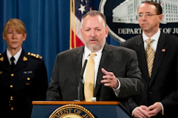 Drug Enforcement Administration Acting Administrator Robert Patterson, center, accompanied by Royal Canadian Mounted Police Assistant Commissioner Joanne Grace Crampton, left, and Deputy Attorney General Rod Rosenstein, right, speaks at a news conference at the Justice Department in Washington, Tuesday, Oct. 17, 2017, to announce the indictments of two Chinese fentanyl trackers in the fight against opiate substances from entering the United States.