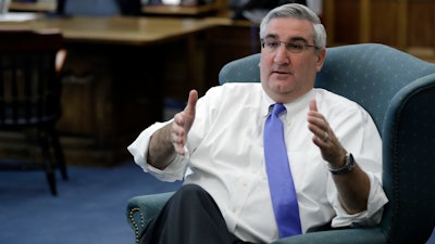 Indiana Gov. Eric Holcomb responds to a question during an interview, Wednesday, Oct. 4, 2017, in Indianapolis.