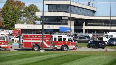 Woodhaven fire department personnel remain on the scene of a shooting at a Ford Motor factory Friday Oct. 20, 2017, in Woodhaven, Mich.