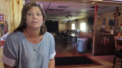 Tammy Graceffa, 51, owner of the Hiawatha Bar and Grill, talks in her restaurant on Wednesday, Oct. 4, 2017 in Sturtevant, Wis., about Foxconn's announcement of the location of its planned manufacturing plant in nearby Mount Pleasant. Graceffa owns land in the development site and said the news was bittersweet because she stands to benefit economically but she might lose the land where she grew up.